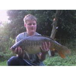 Chris Farnan with a record 16lb 9oz Mirror Carp from the Top Lake