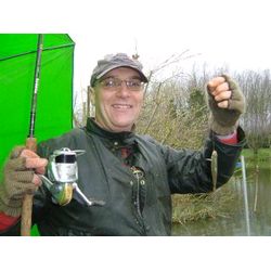 Angling Training - Phil Hacking with one of the smaller roach from the session