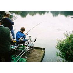 Robert plays a fish under supervision from John Lake