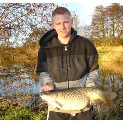 Alex Stanbridge with his catch of the session, a 13lb 8oz Common Carp